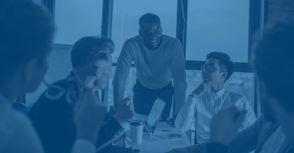 Office Workers Gathered Around Table