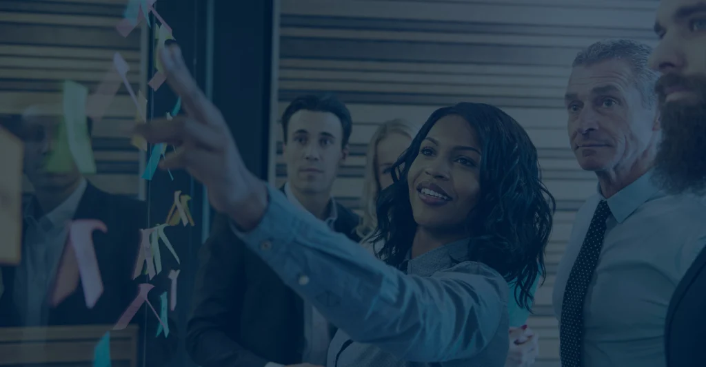 Team collaborating and discussing full offerings of retirement plan design